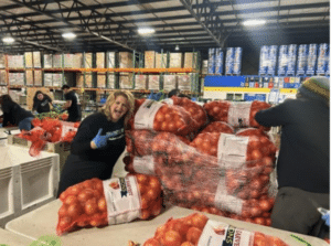 SearchPro team volunteering at community event.