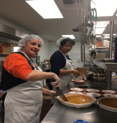 SearchPro team volunteering at community event.